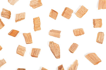 Wooden smoking chips isolated on a white background, top view. Natural wood smoking chunks. Ecological fuel.