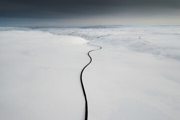 Winding Road Through Snowy Landscape