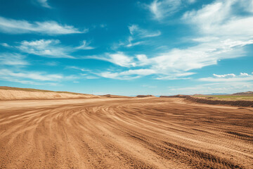Fototapeta premium Motocross and auto track on blue sky background with sand wheel tracks