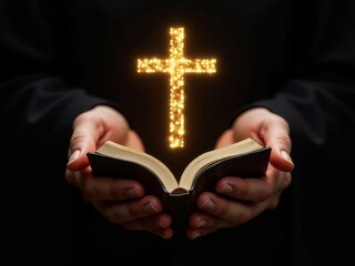 hand holding open bible with golden glowing cross hologram on dark background.