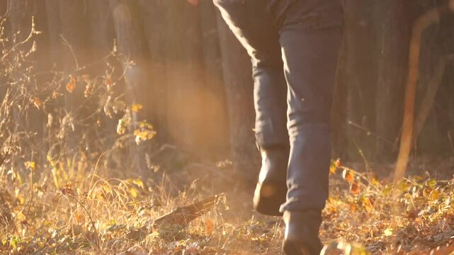 man running through the forest slow motion