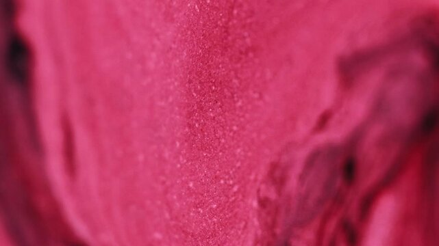 Ink emulsion. Glitter flow. Glowing texture crimson pink red black mix pigment sparkling particles motion hypnotical abstract art background.
