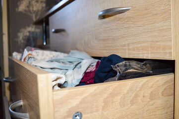 open drawer filled with clothes towels storage systems wardrobe organization or closet solutions...