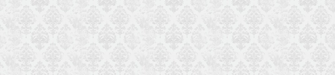 A plain, light gray, patterned background.