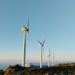 Windmills standing on the mountain at sunset