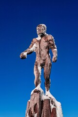 Naklejka premium A wooden sculpture on the Zugspitze in Tyrol, Austria