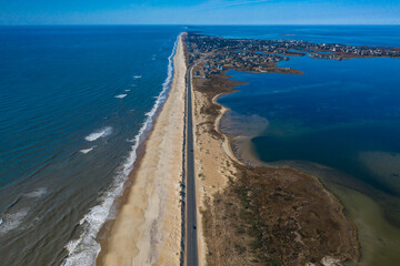 Drone aerial view of Outer Banks Highway 12 with Atlantic Ocean and Sound on both sides, Cape...