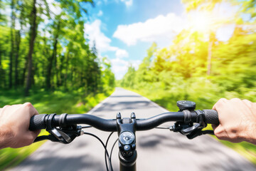 Cyclist riding on serene forest path during bright daylight, enjoying fresh air and beautiful scenery. sun shines brightly, enhancing vibrant greens of trees
