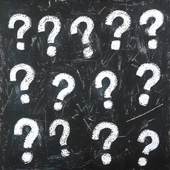 Chalk Question Marks on Blackboard