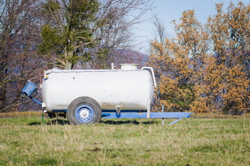 Livestock watering tank on the pasture. Watering place for cows.