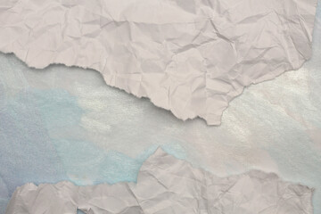 Torn, ripped crumbled paper pieces wave crack . Beige neutral copy space texture poster background.