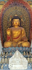 Sitting Buddha Statue Decorated with Gold with Sacred Background
