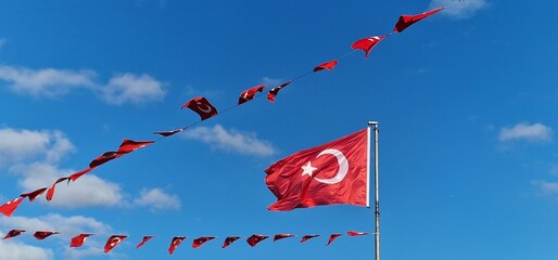 Turkish flag on a public holiday with many small Turkish flags