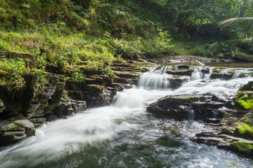 Long exposure of a waterfall on the East Lyn river at Watersmeet in Exmoor National Park