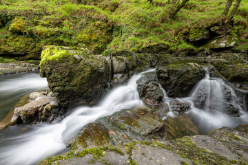 Long exposure of a waterfall on the East Lyn river at Watersmeet in Exmoor National Park