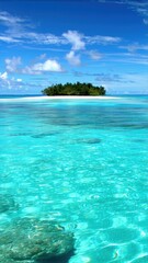 Fototapeta premium Turquoise water with a small island in the distance