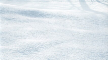 Obraz premium Close-up of fresh, fluffy snow on the ground, showcasing a beautiful winter texture with a subtle bluish tint