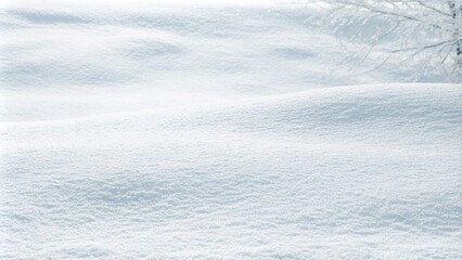 Close-up of fresh, fluffy snow on the ground, showcasing a beautiful winter texture with a subtle bluish tint