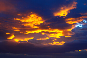 a sky with the sun shining through clouds