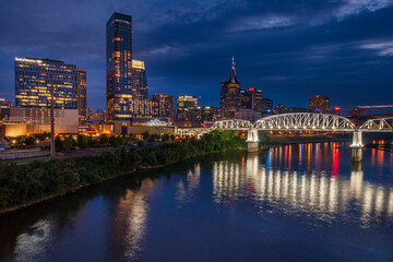 sunset to night view of Nashville Skyline as seen over the Cumberland River
