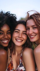 Fototapeta premium Three women are smiling and hugging each other