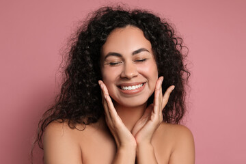 Cosmetology. Beautiful woman with perfect skin on pink background