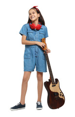 Girl with headphones and guitar pretending to be musician on white background. Dreaming of future profession