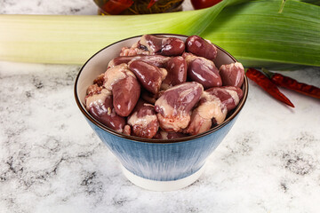 Raw chicken hearts in the bowl