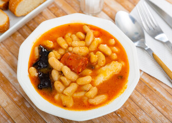 Tasty homemade stew of asturian beans with sausages. Traditional Spanish cuisine