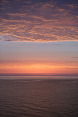 Beautiful sunrise on the Black Sea coast.  Golden hour. Kurortne. Odessa region. Ukraine. Vertical photo.