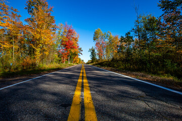 Highway 107 going through a colorful Wisconsin forest in early October