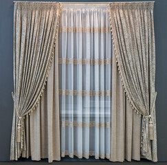 Modern interior design in beige tones. Straight double curtains with antique effect and translucent tulle with geometric pattern