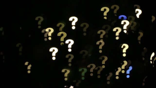 Glowing question marks bokeh lights background abstract pattern on black background.