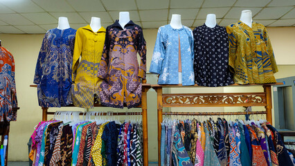 Colorful batik clothing displayed on mannequins and racks. Perfect for fashion blogs or promoting Indonesian culture