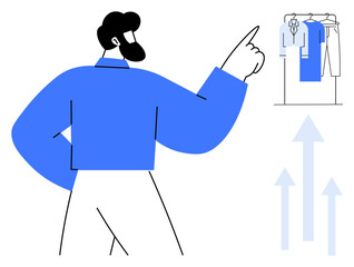 Man pointing at a rack of clothing, representing decision-making and fashion trends. Ideal for themes thumbs up fashion advice, personal growth, retail, career success, business strategy, style