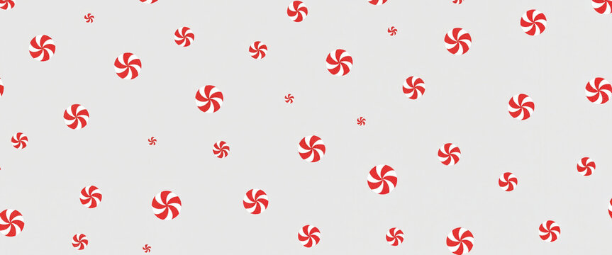 Background with red peppermint candy pattern on white