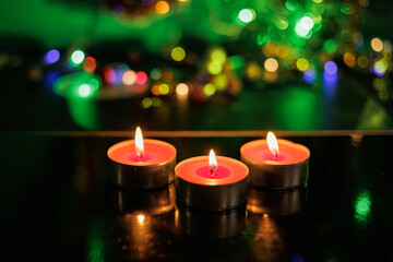 smoke from extinguished natural soy candle in dark glass jar on dark gray background. romantic atmosphere. new year christmas card. Christmas tree,