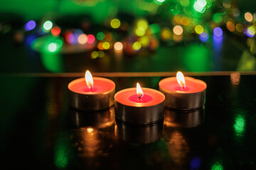 smoke from extinguished natural soy candle in dark glass jar on dark gray background. romantic atmosphere. new year christmas card. Christmas tree,