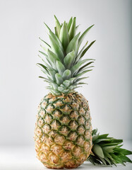 Fototapeta premium Fresh whole Pineapple, peeled or cut on a natural light white