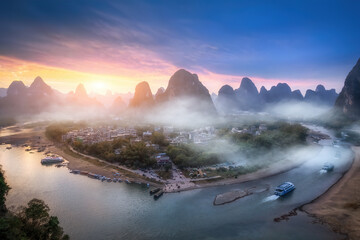 Serene River Valley at Sunset Surrounded by Majestic Mountains