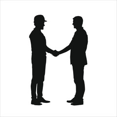 Silhouette of two people shaking hands to make a deal on a project