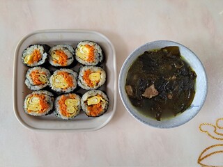 Delicious kimbap rolls filled with fresh vegetables, seasoned rice, and savory proteins, all wrapped in crisp seaweed. A perfect combination of flavor and texture in every bite.

