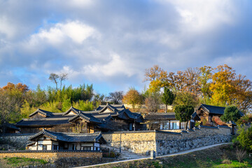 Autumn scenery with an old traditional Korean tile-roofed house (Hanok)