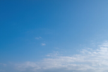 Serene Blue Sky with Soft Clouds Perfect for Calm Backgrounds