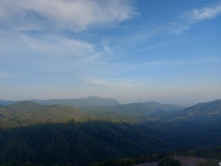 Panoramic view from Wat Phra That Pha Sorn Kaew showcasing lush green mountains under a clear blue sky.