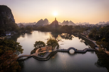 Tranquil Sunset Over a Scenic Lake Surrounded by Majestic Mountains
