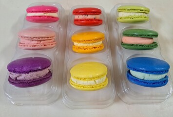 Colorful macarons with a delicate, crispy shell and soft, flavorful filling. Perfect for dessert photography, showcasing these elegant French treats in a variety of flavors and vibrant pastel colors.
