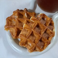 Crispy, golden waffles topped with creamy ice cream, creating a perfect balance of warm and cold, crunchy and smooth. A delightful dessert or breakfast treat, made even better with toppings like fruit