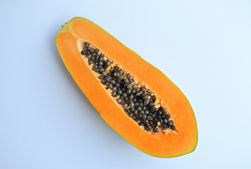 Top view of sliced papaya with seeds. Isolated on the white background.