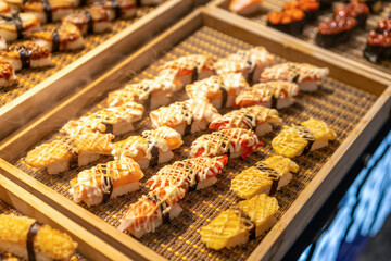 Exquisite Sushi Selection Showcased on a Traditional Bamboo Platter